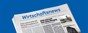 Zeitung mit der Aufschrift Wirtschafts News